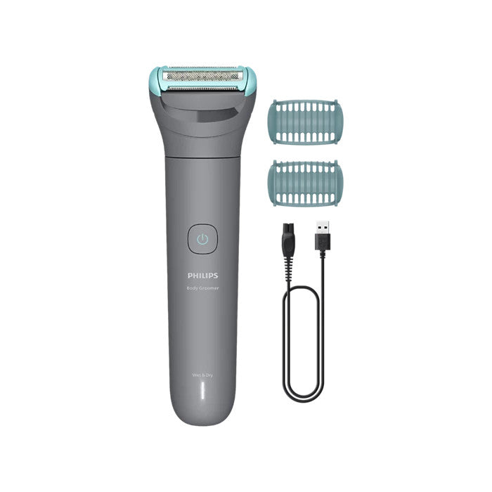 Philips electric shaver with attachments and charging cable on a white background